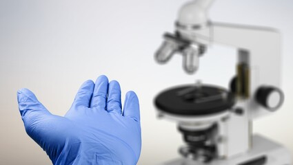 scientist prepare blood sample for research on microscope. Microscope slide. Science and medicine concept.