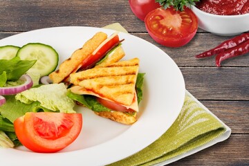 Tasty fresh sandwich with sauce on the table.