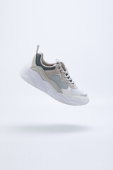 White with colours Athletic Sports Shoes suspended on the air with white background