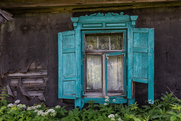 Very beautiful old, green wooden windows in abandoned house, Latgale, Latvia.