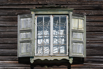 Old window of Krivani Old Believers Church in sunny summer day.