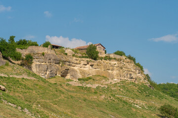 Fototapeta premium Ancient city road cave chufut bakhchisaray crimea medieval street monument, concept sunny building in historic for travel chufut, autumn karaite. Town outdoors crimean,