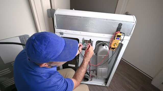 Appliance Technician Checking Voltage on an Electric Dryer
