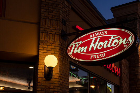  
Niagara Falls, Ontario, Canada - July 22, 2022: Tim Hortons sign in the night. Tim Hortons is a Canadian-based multinational fast food restaurant opened in 1964.
