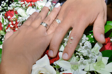 bride and groom holding hands