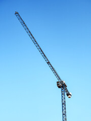 Crane against the sky. Bottom view. Construction