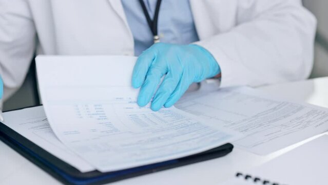 Doctor, medical professional or scientist writing a report, signing documents or taking notes while working in a science lab. One expert planning, creating a checklist or doing paperwork at a factory