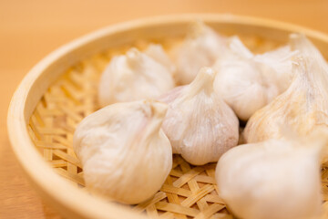 Stack of whole garlic on basket