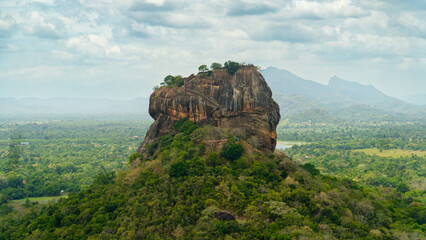 Fototapeta na wymiar Sigiriya Rock or Lion Rock near Dambulla in Sri Lanka. Green rainforest and jungle.