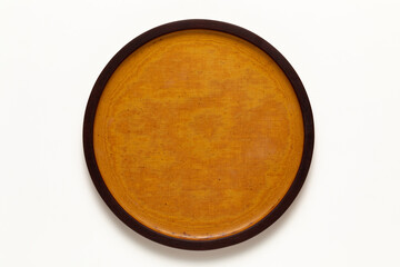 Bakelite round plate on white background.