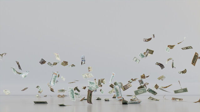 Cash Falling to the ground against White Backdrop. Savings concept, featuring Mixed Denomination Bills with copy-space.