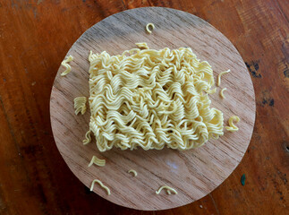Closeup photo of raw noodles on a wooden tray. Fast food. Modern food.
