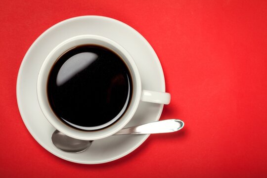 Cup of Coffee on Red Background
