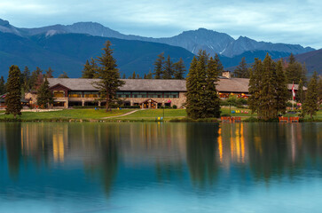 Reflection of Jasper Lodge facade in Beauvert Lake, Jasper national park, Alberta, Canada.