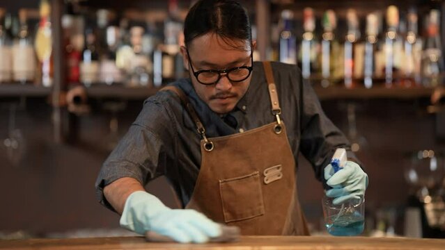 Night club concept of 4k Resolution. Asian staff cleaning the restaurant before getting ready to open. A group of specialized clubs that sell alcoholic beverages.