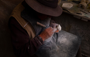 latin man doing craft work