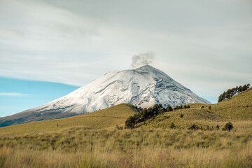 snowy crater of an active volcano