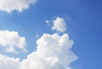 Naklejka na ściany i meble White clouds and blue sky on a clear day.