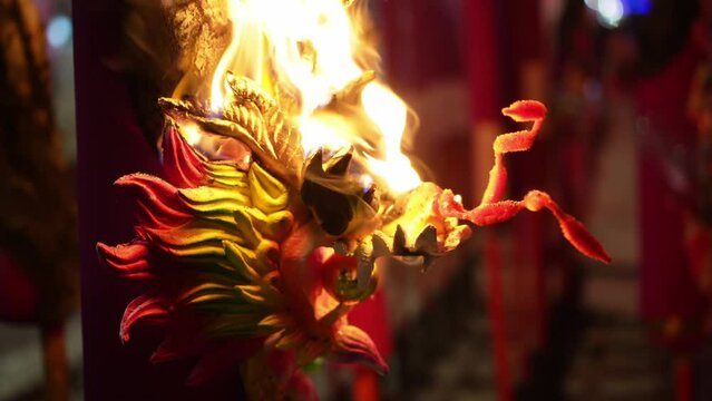 Close up the head of dragon incense stick on fire