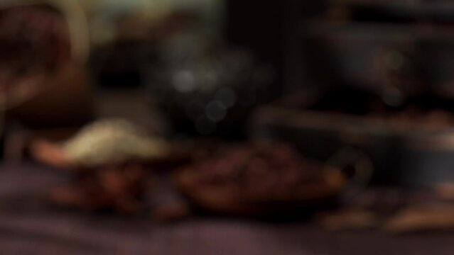 Chinese traditional seasoning five spice powder and raw materials on retro background