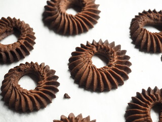 beautiful fluted round shape of piped chocolate cookies