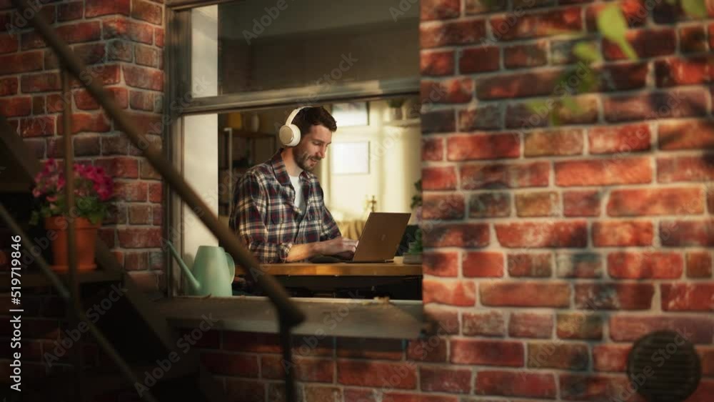 Poster professional home office worker receives good news message on smartphone while typing on laptop comp