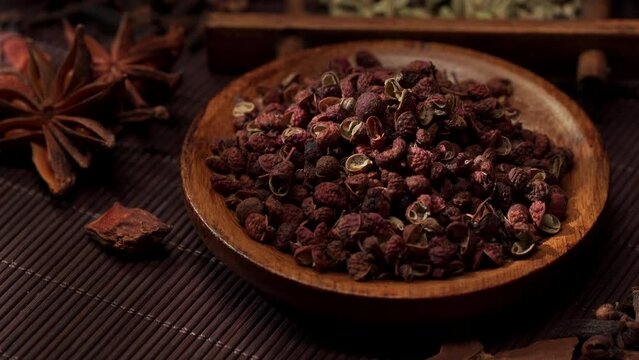 Chinese traditional seasoning five spice powder and raw materials on retro background