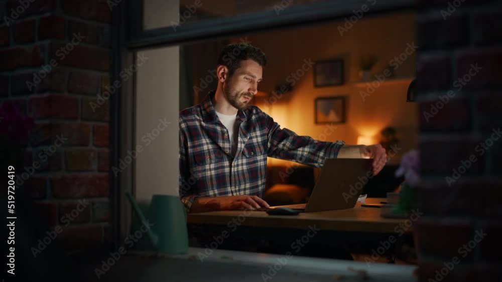 Poster creative professional man opens laptop, puts on headphones and starts working. it specialist writes 