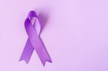 International Overdose Awareness Day. National Opioid Awareness Day. World Cancer Day. The purple ribbon on the purple background