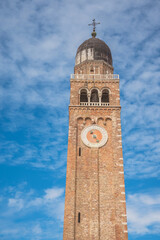 Chiesa Saint Andrea catholic church building with brick bell tower, Chioggia, Italy.