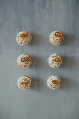 Sweet pastries decorated with caramel and salted pretzels