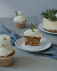 Delicious pastries decorated with flowers and greenery