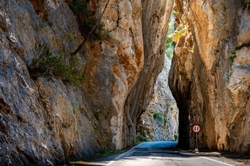 A narrow bottleneck in a dangerous curve of the Serra de Tramuntana mountain road MA-2141 leads...