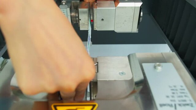 Polymer thread sample tape for plastic sack bags is installed to strength test machine