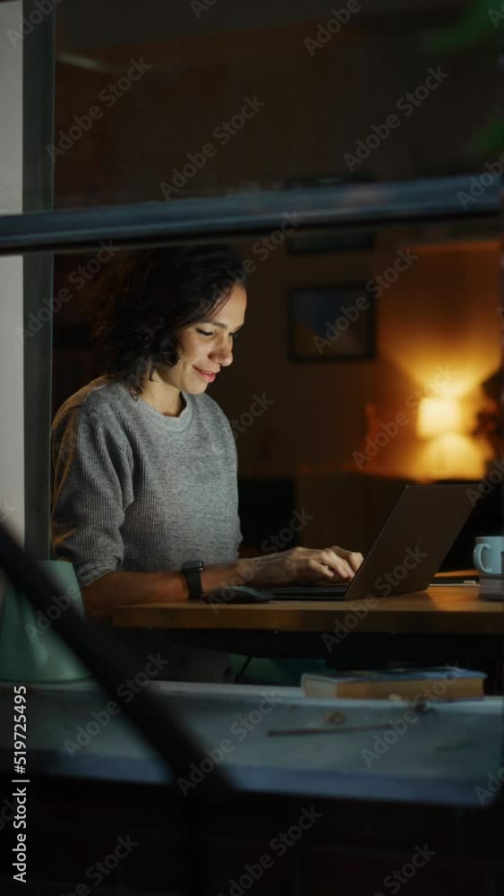 Aufkleber vertical screen: brazilian woman sitting in front of laptop remotely working on a project. happy pro