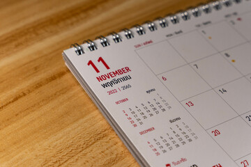 Nov month 2022 Calendar page on wooden background