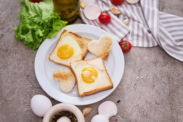 Fried Egg on Toast Bread on concrete table for Breakfast