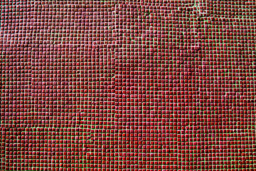 Close up of red ceramic tiles on historical wall