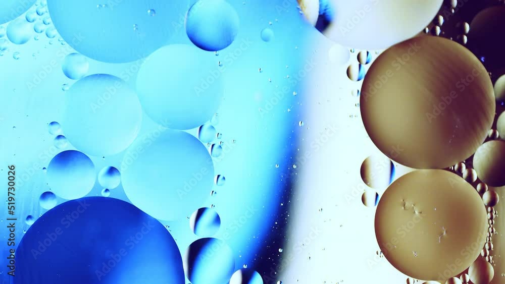 Aufkleber real close up oil bubbles in water rotation with color gradient abstract mixing background.