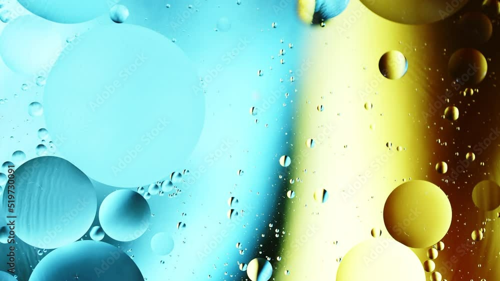 Poster real close up oil bubbles in water rotation with color gradient abstract mixing background.