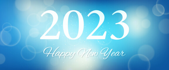 Happy new year 2023 incription on blurred background