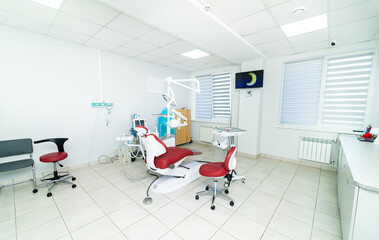 Bright dentel cabinet with sterile equipment. Dental treatment in modern hospital.