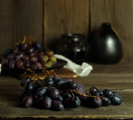 Ripe dark pink grapes on the kitchen table