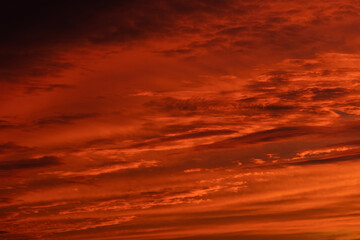 Orange and red sky at sunset and dawn. structure and texture of clouds. different shapes and types of sky. Photo and wallpaper on the desktop. beautiful transfusion of colors and smooth transition.