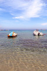 Pedal boat and motor boat at  Sant Andrea, Elba Island, Italy, a white sandy beach perfect for...