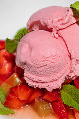 Strawberry ice cream with strawberries and fresh mint