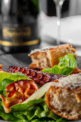 Caesar salad with octopus