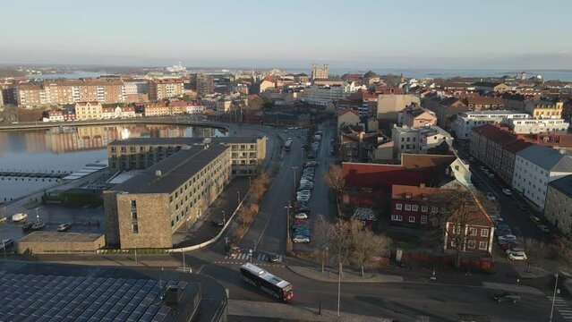 Aerial footage on a cold winter day in Karlskrona, Sweden with a view of the beautiful churches in the background, the city skyline and the boat docks in front of Scandic hotel.
