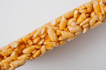 Sweetness from grains of puffed rice, shot close-up on a white background.
