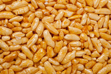 Sweetness from grains of puffed rice, shot close-up on a white background.